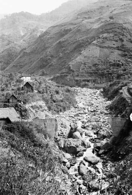 Washed-out bridge near Banos showing effects of mountain torrents
