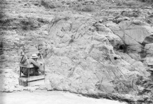 Further views of bridge and expedition materials being ferried across in cable car.