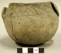 Ceramic complete vessel, mended, 2 handles, incised design around rim