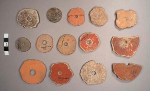 33 pottery spindle whorls: perforated