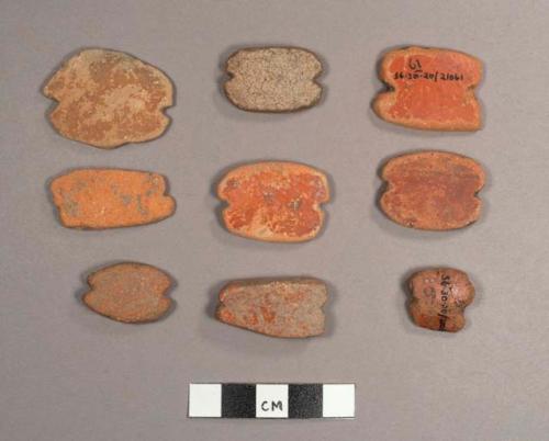 9 end-notched potsherds