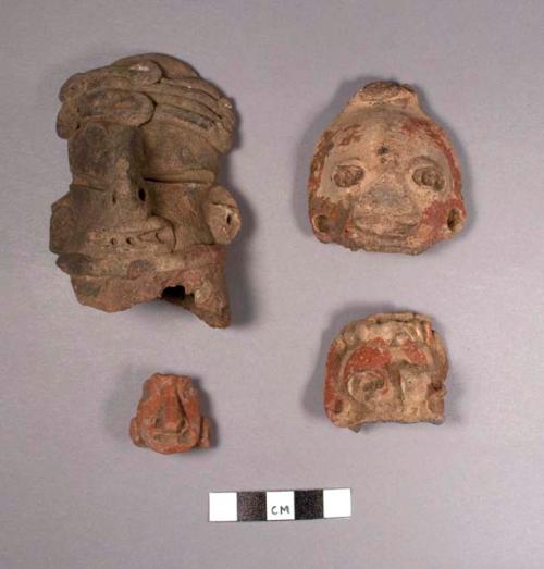 4 pottery heads (human)