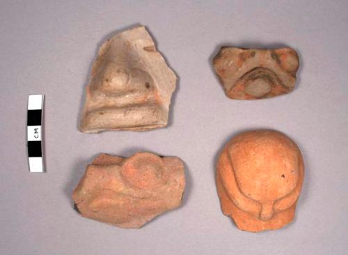 4 pottery faces (human and animal)