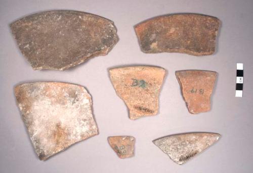 24 sherds of unslipped ware- lids and possible dishes