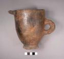 Small pitcher of buff ware
