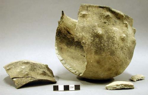 Ceramic partial vessel, flared rim, raised design