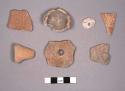7 miscellaneous pottery artifacts; 2 incised potsherds