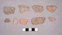 9 monochrome ware sherds from bowls with brush marking, incisions & impressed ma