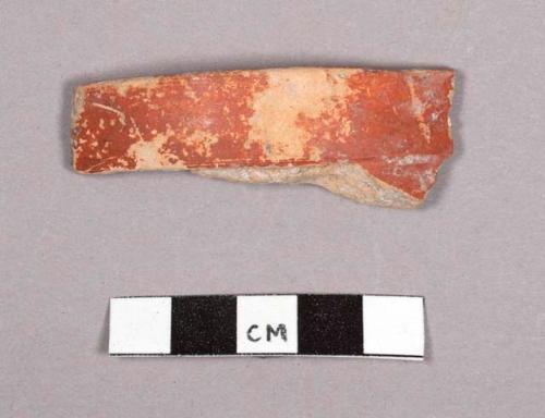 Red ware tripod sherd