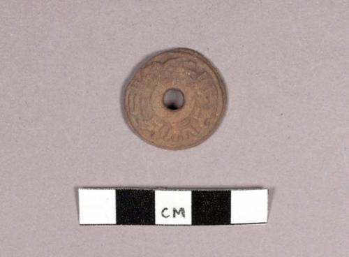 Small pottery spindle whorl