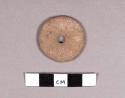 Small pottery spindle whorl