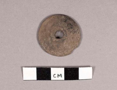 Small pottery spindle whorl