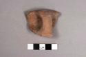 Plain ware rim potsherd with handle