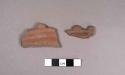 2 rim potsherds with relief decoration