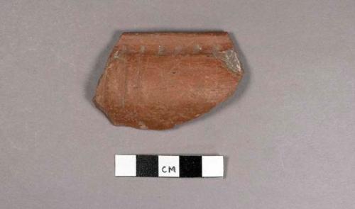 Rim potsherd with puncatations