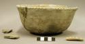 Ceramic bowl, incised rim, sherds inside