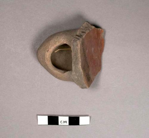 Pottery vessel foot with large perforation