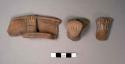 3 rim potsherds with handles in form of arm and hand