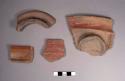 4 plain red rim potsherds