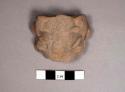 2 pottery figurine head fragments