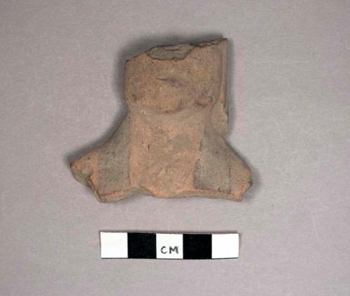 Neck and lower head of pottery figurine