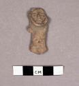 Small pottery figurine with collar-like arrangement around face
