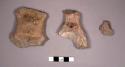 2 large pottery figurine body fragments