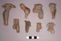 9 pottery figurine bodies with one leg