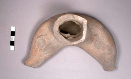 Large seated hollow pottery figurine fragment (abdomen and legs)