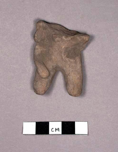 Pottery figurine body with part of head
