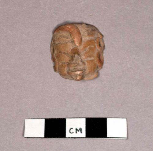 Ceramic anthropomorphic figurine head