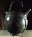 Water cooler - pottery vessel with 2 spouts and a handle, incised designs.  Muli