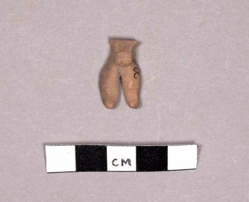 Legs and abdomen of tiny pottery figurine