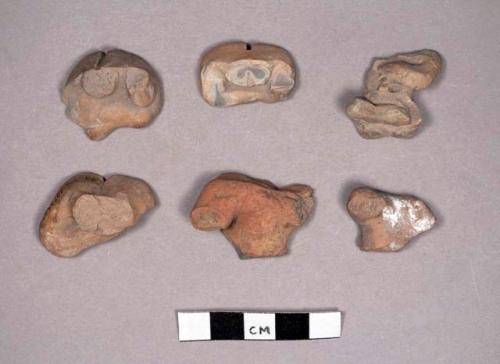 Fragments of sitting pottery figurine-hips