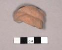 Clay object- figurine headdress fragment