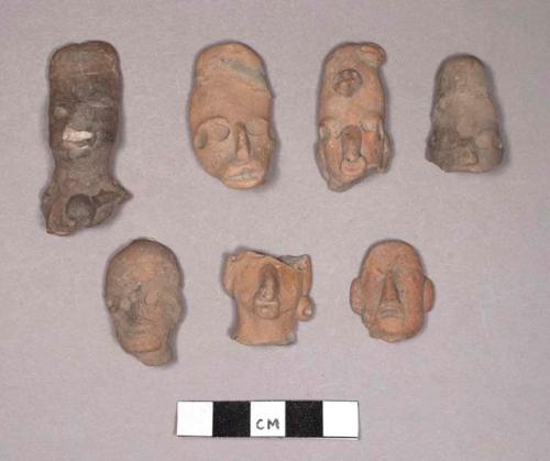 Long pottery figurine heads