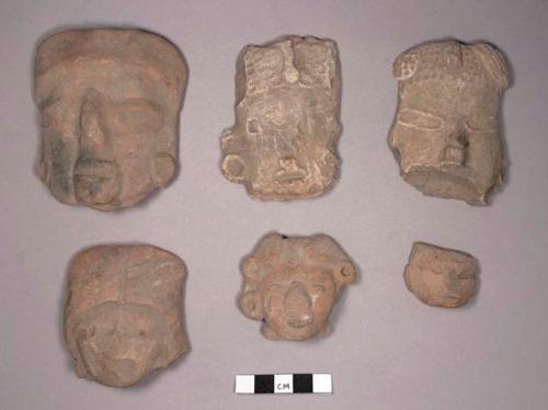 Large pottery figurine heads