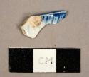 Blue feather-edged pearlware sherd, possibly from a platter