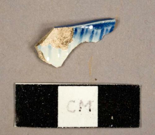 Blue feather-edged pearlware sherd, possibly from a platter