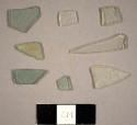 Assorted flat aqua, green, and colorless glass fragments