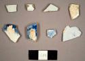 Pearlware sherds, including one blue feathered-edge plate rim sherd, one sherd with blue transfer print, and one blue sherd with mottled blue glaze on one side