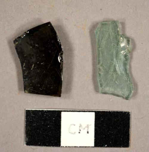 Glass fragments, including one aqua flat glass fragment and one olive green bottle glass fragment