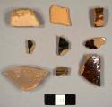 Glazed and unglazed redware sherds, including rim sherds to a pan and a jar