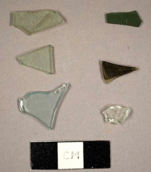 Miscellaneous flat glass fragments, including aqua, colorless, and olive green fragments