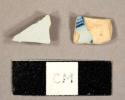 Tin-glazed earthenware sherds, one with handpainted blue lines