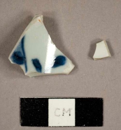 Chinese porcelain sherds, including one saucer base sherd with handpainted blue decoration