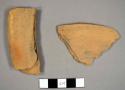 Unglazed orange earthenware sherds, including possible rim sherds to a pan