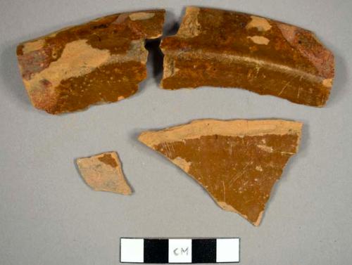 Lead-glazed redware sherds, including possible rim sherds to a pan