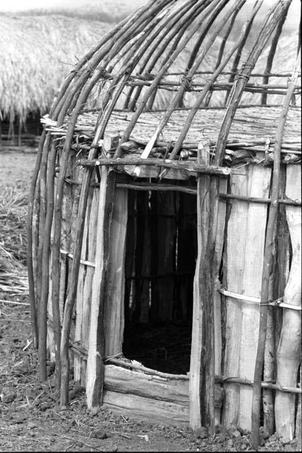 Dumakonem. entrance, dome, and left floor of unthatched ebeai.