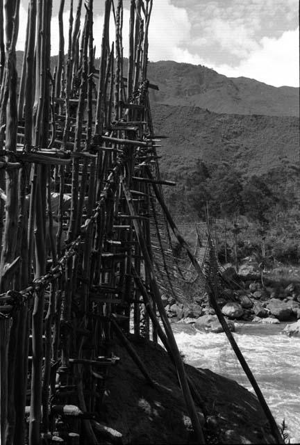 Swinging bridge across Baliem just below Gutima (Kurima) Police Post